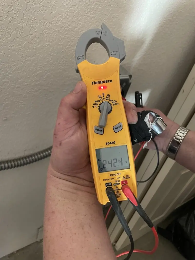 Voltage testing with clamp meter during Recessed Lighting Installation in Ocean View